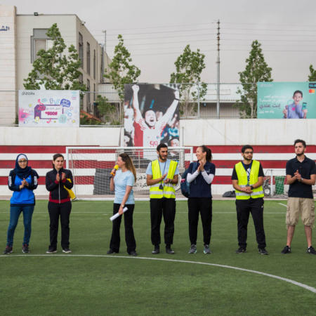 girls_football-jordan-join_in_is_everything Celebrating the winners of a girls' soccer match in Jordan